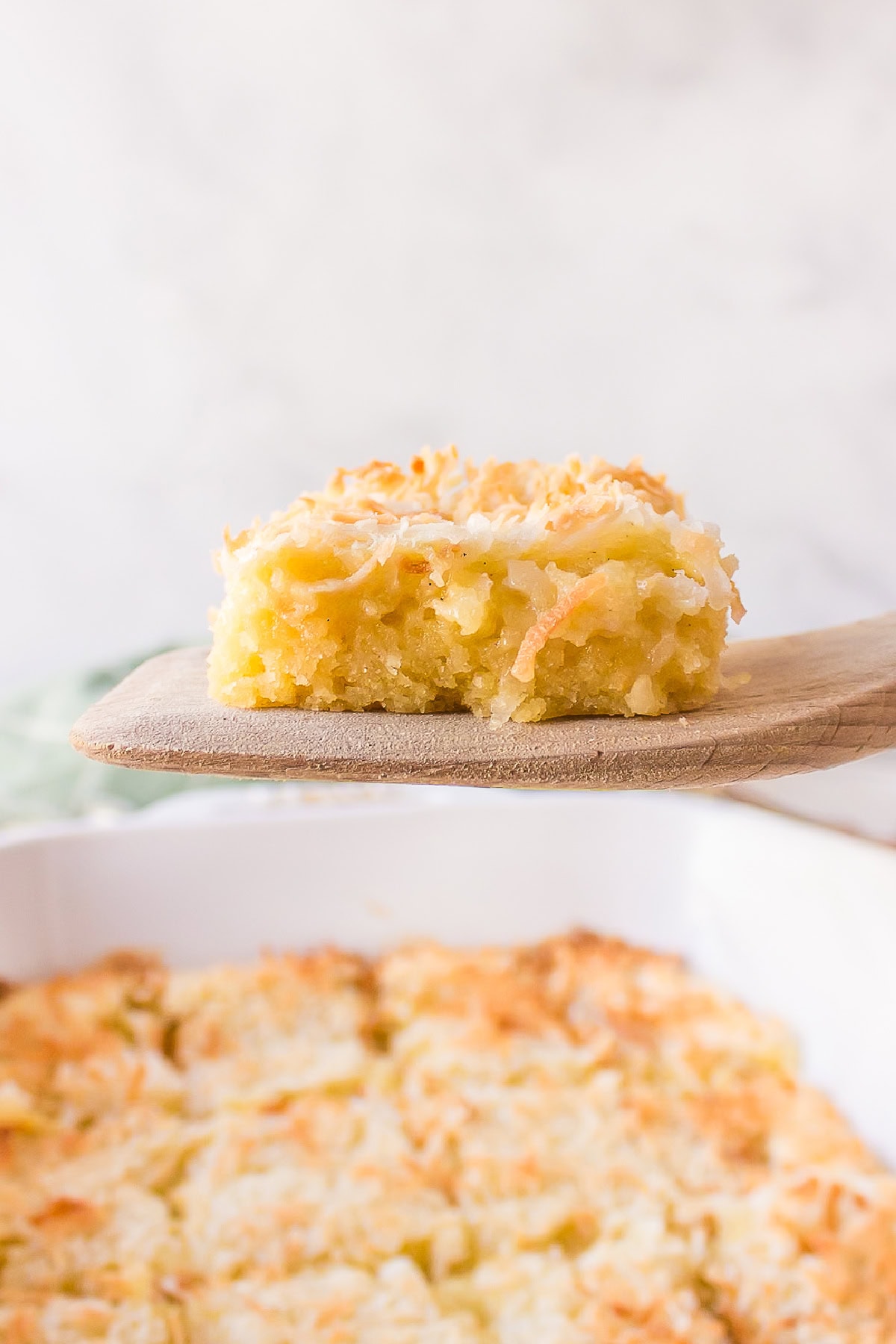 spatula holding an almond coconut bar