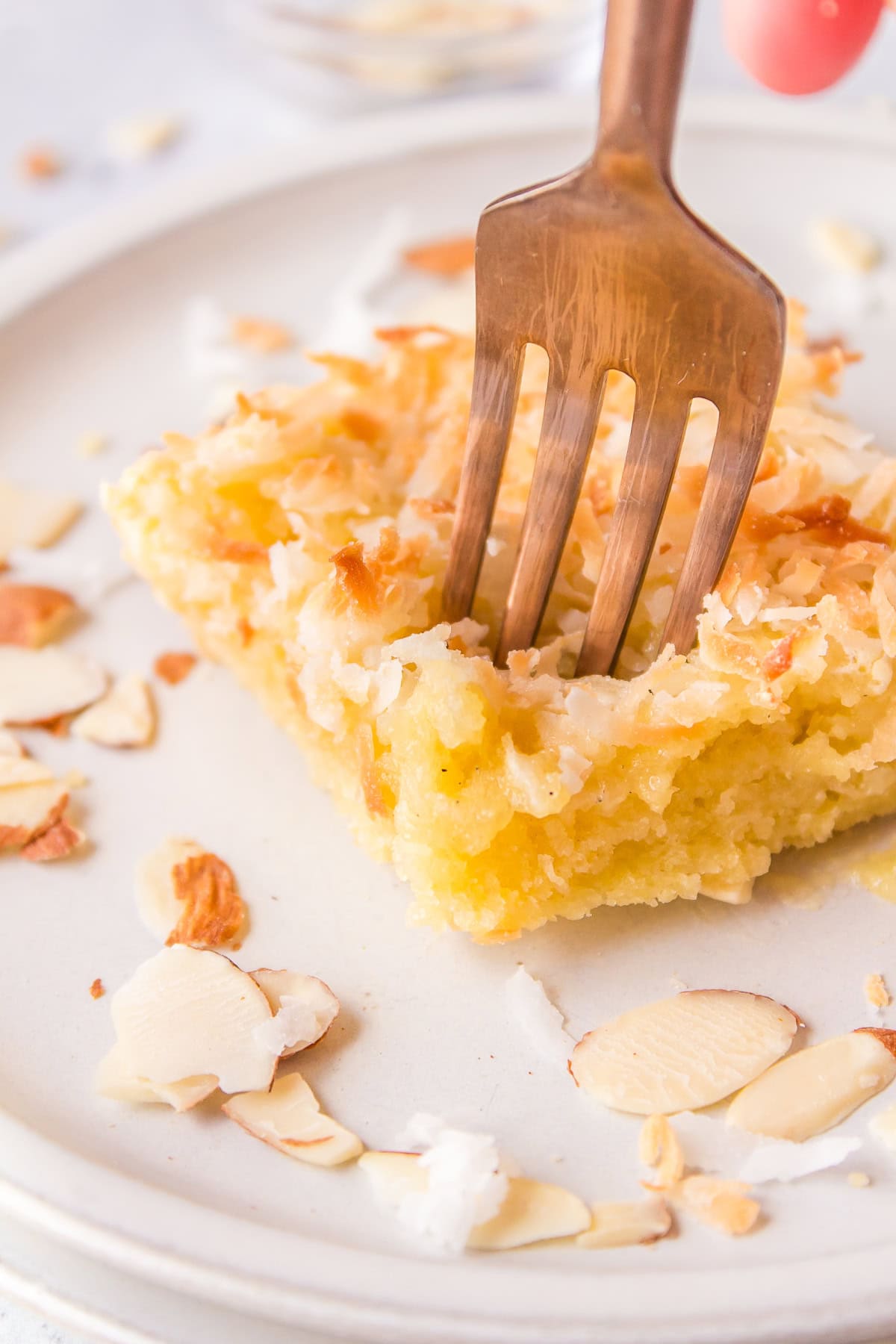 fork stuck into an almond coconut bar