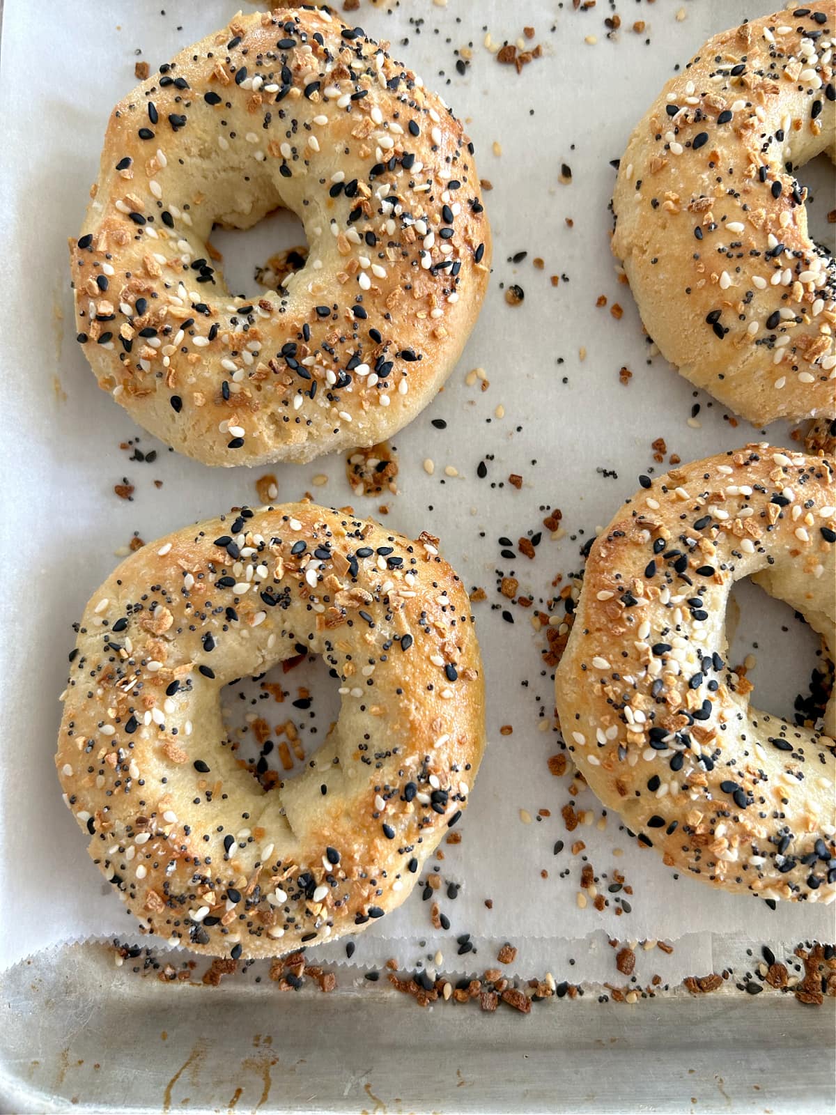 almond flour bagels on baking sheet with everything bagel seasoning