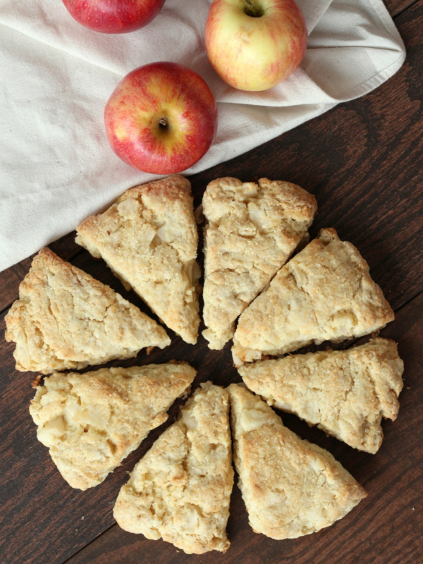 overhead shot of apple cream scones with three fresh apples