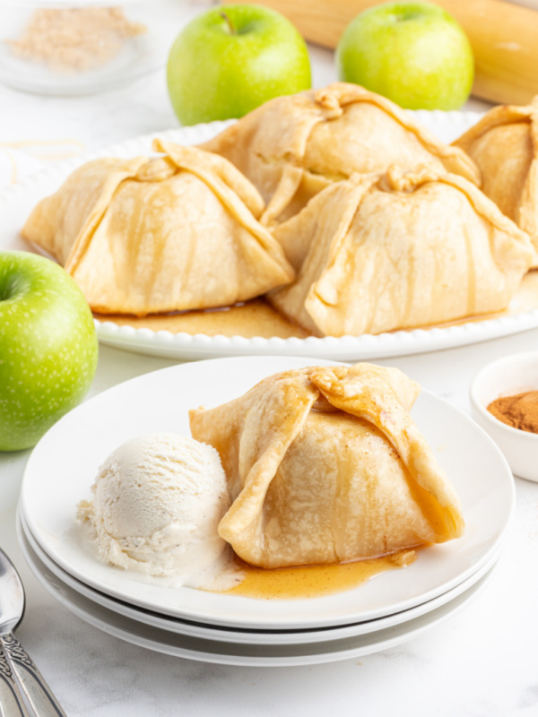 apple dumpling on plate with ice cream