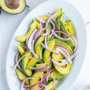 avocado and onion salad on oval platter