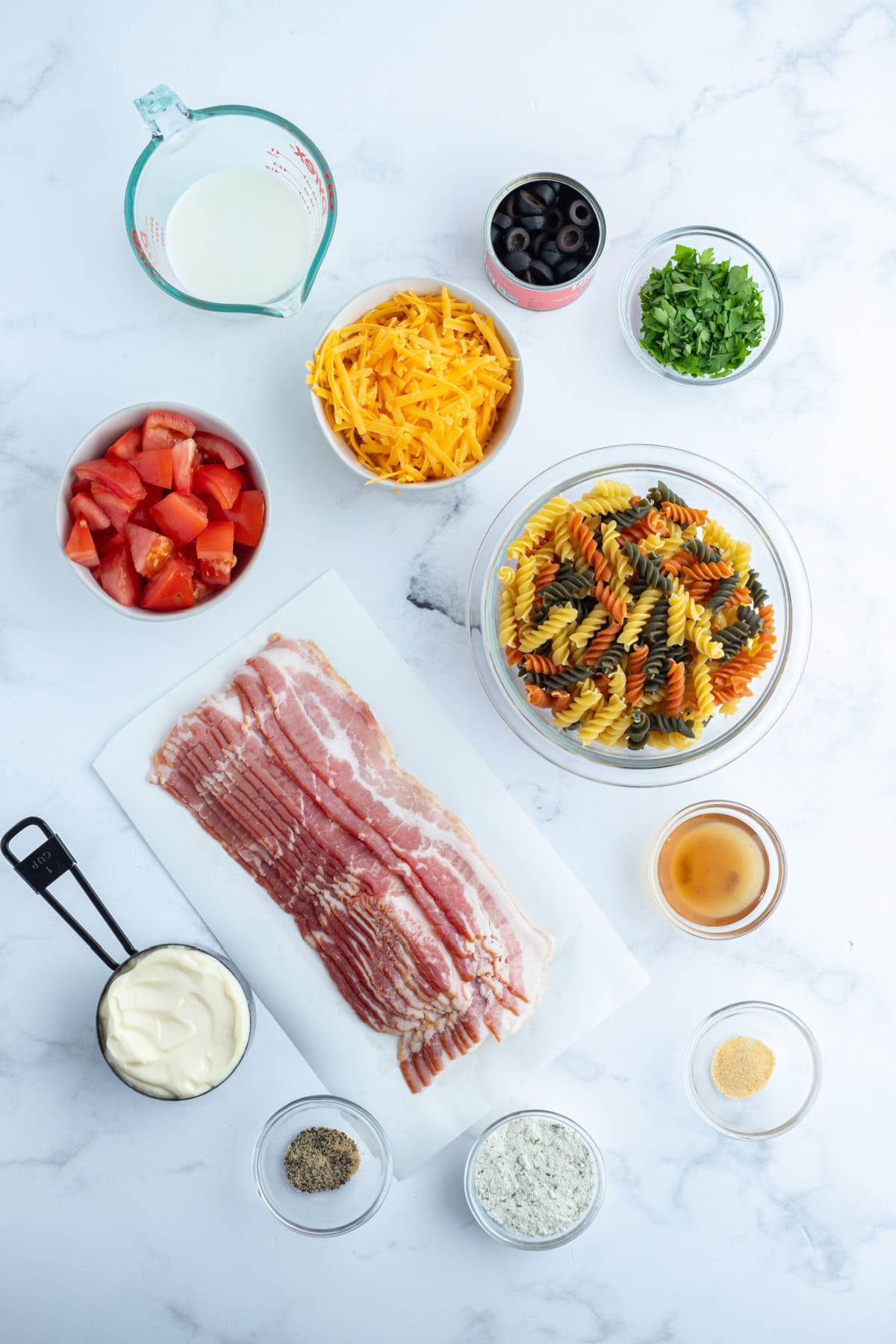 ingredients displayed for making bacon ranch pasta salad