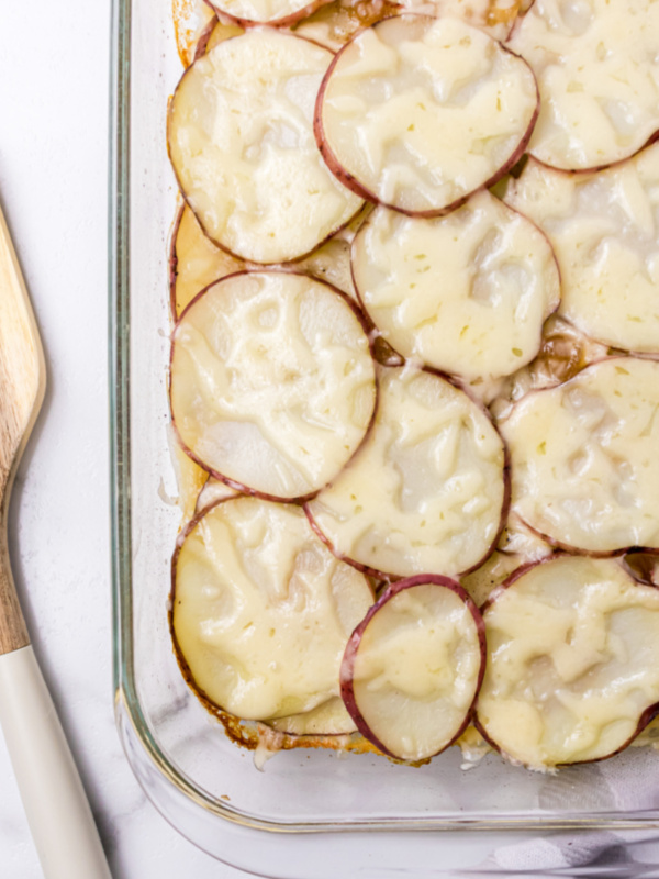 beer baked scalloped potatoes in pan