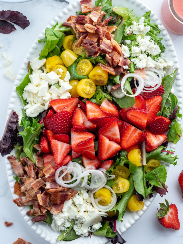 berry bacon and tomato salad on platter