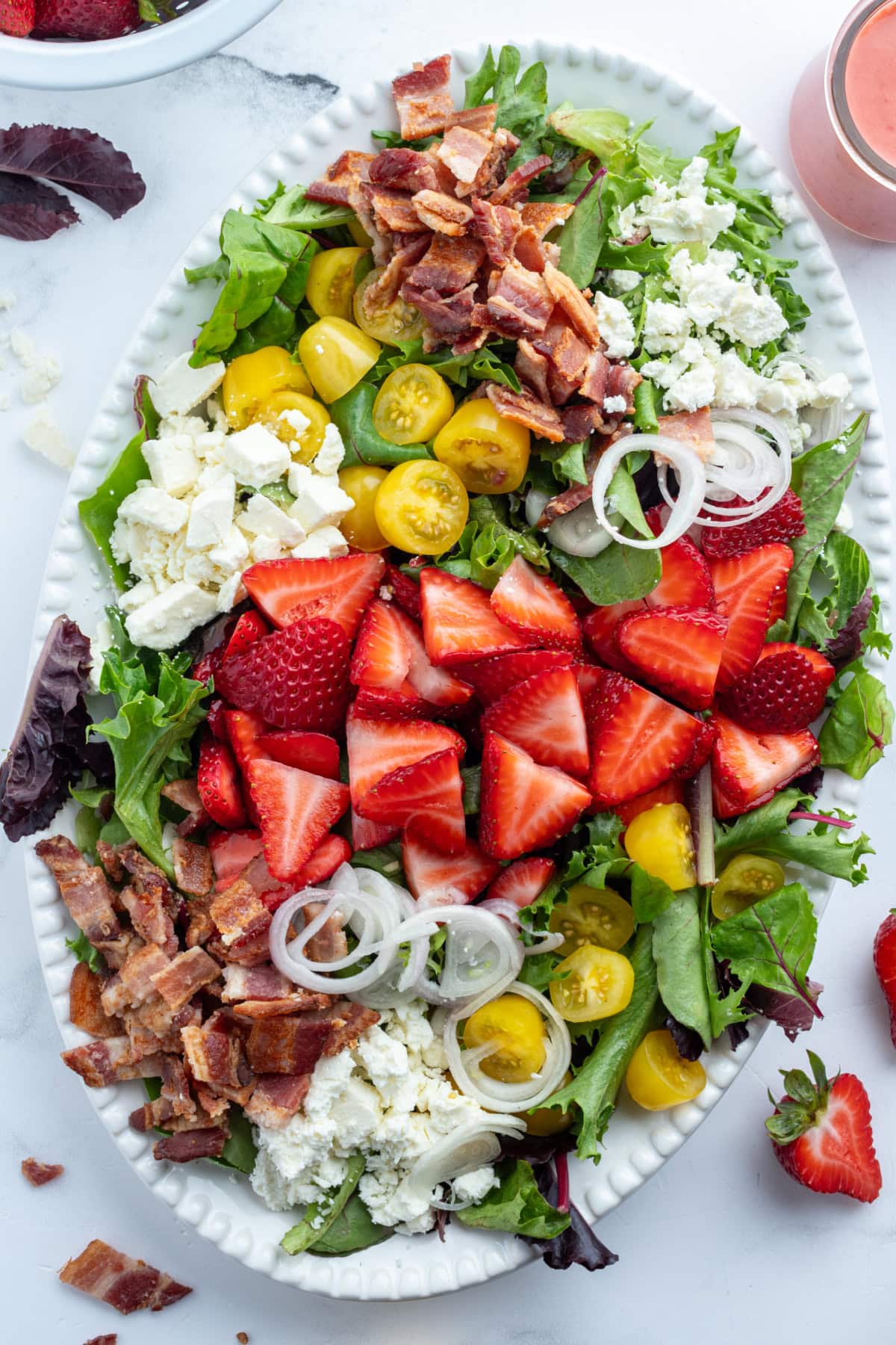 berry bacon and tomato salad on platter