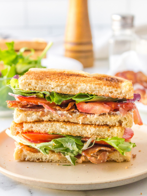 best blt sandwich cut in half and stacked on plate