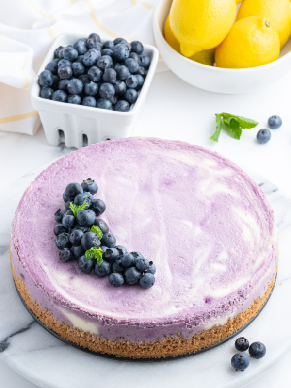 blueberry lemon cheesecake with fresh blueberries on top