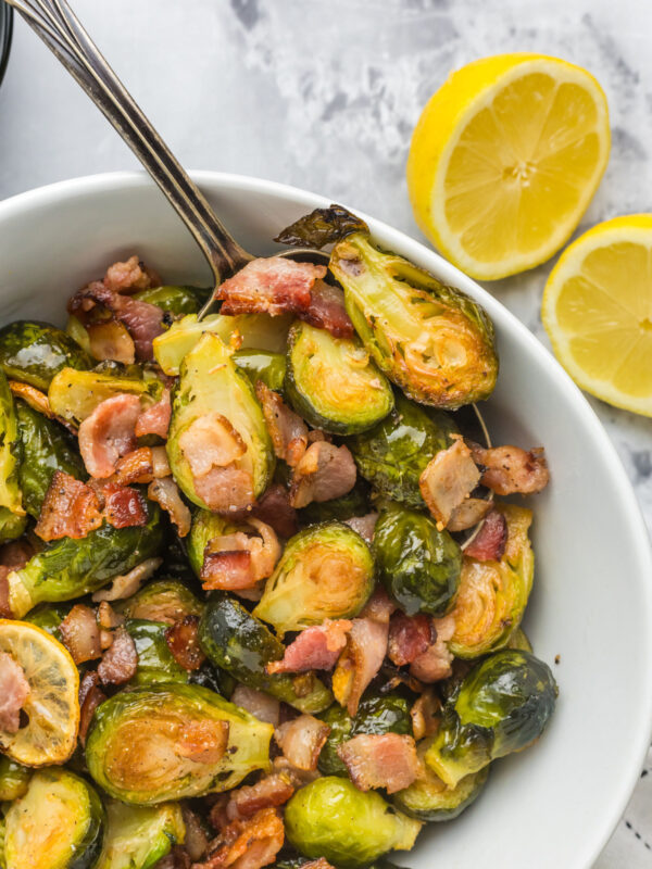 bowl of roasted brussels sprouts with lemon and bacon