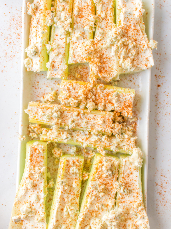 buffalo celery sticks on a white platter