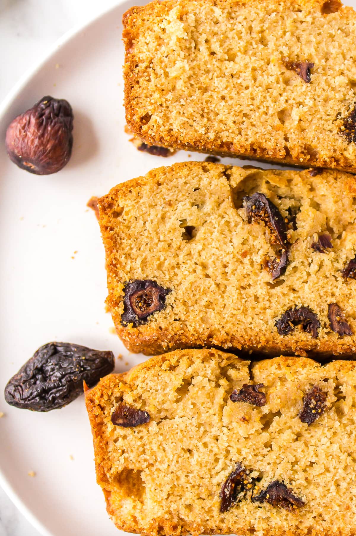 three slices of caramel fig bread on a plate