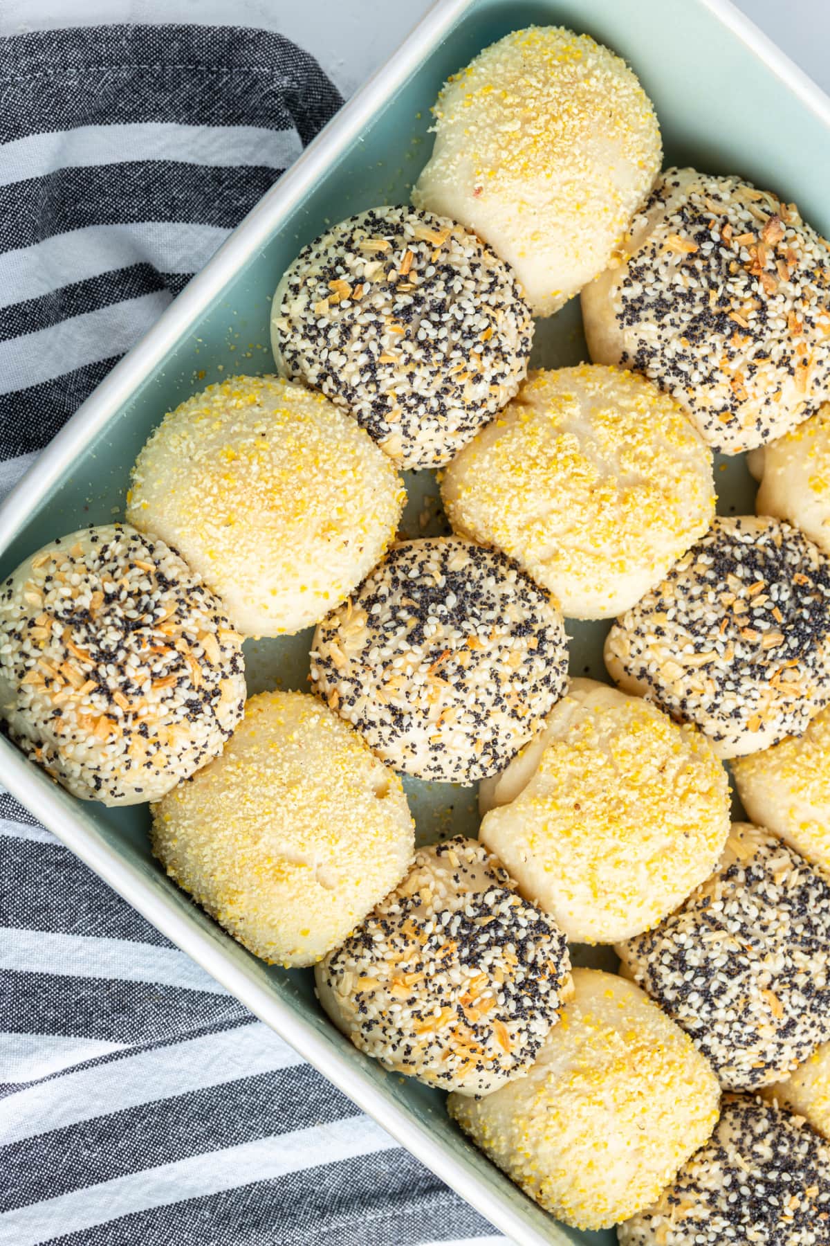 corner shot of checkerboard dinner rolls in pan