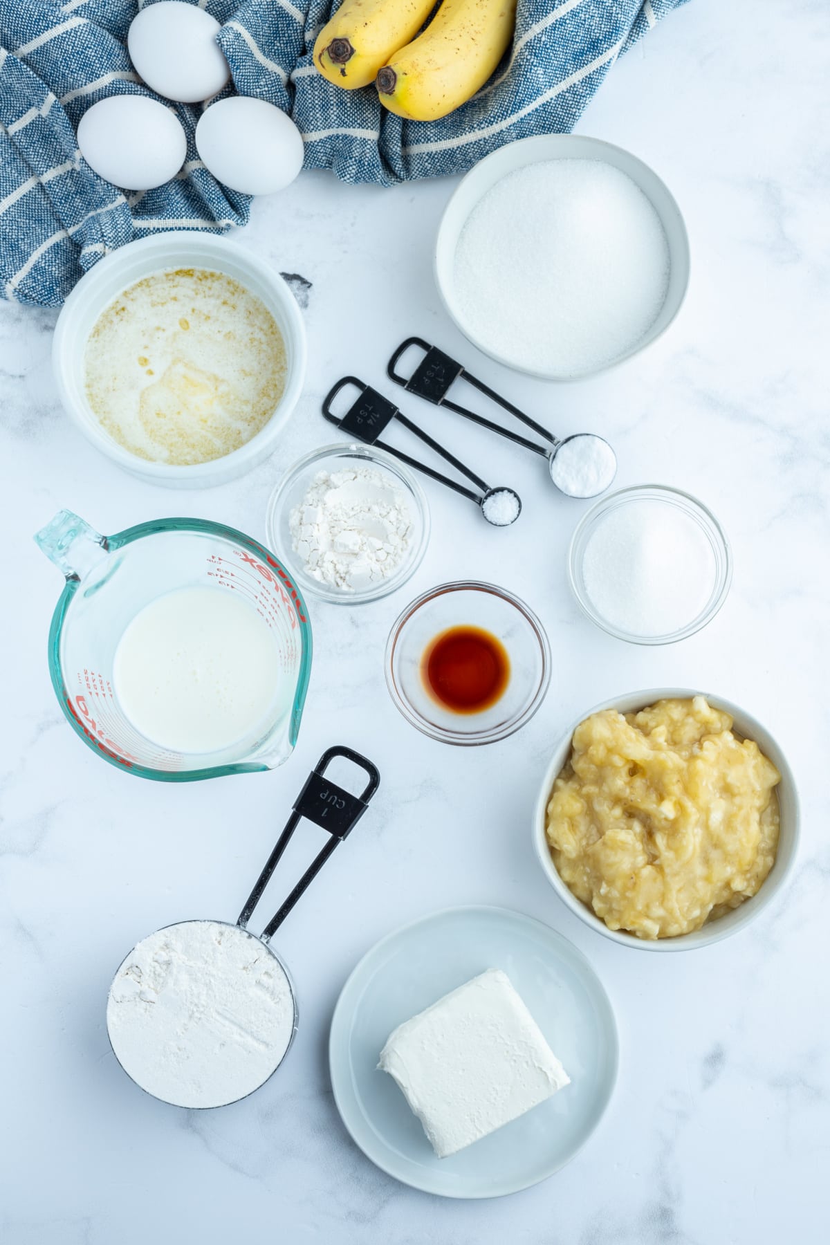 ingredients displayed for making cheesecake banana bread