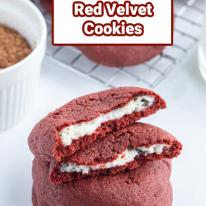 pinterest image for cheesecake stuffed red velvet cookies