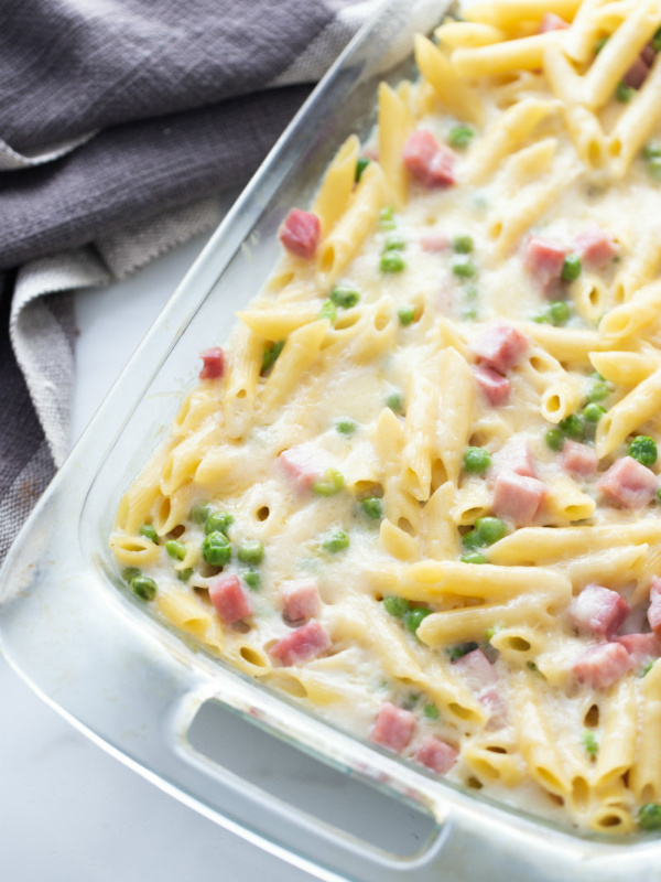 cheesy baked penne in glass dish just out of oven