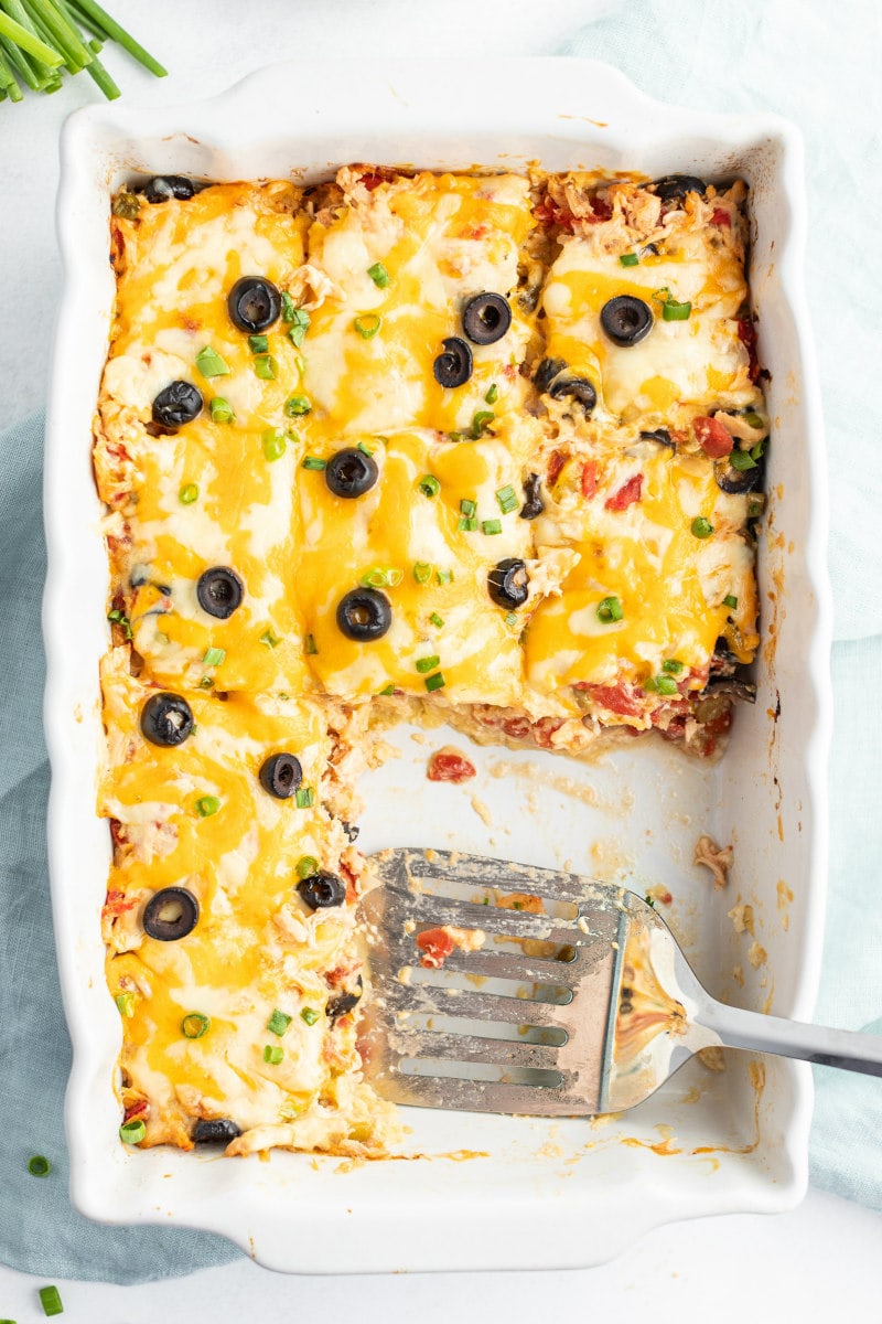 spatula serving chicken enchilada casserole