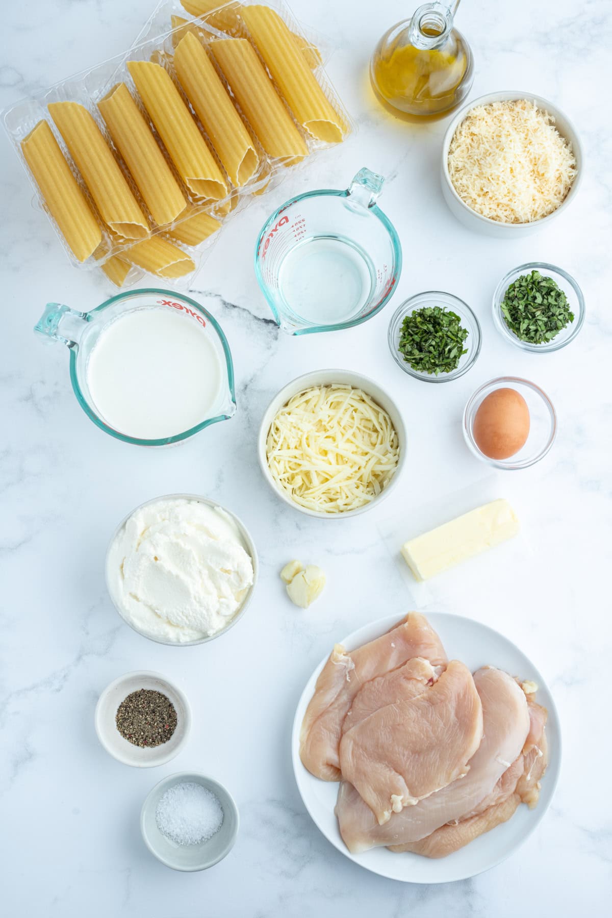 ingredients displayed for making chicken manicotti alfredo