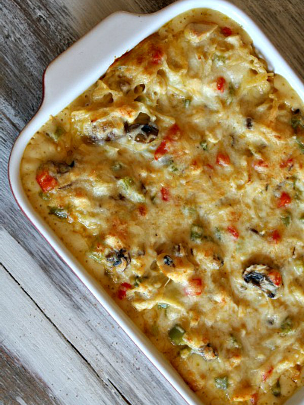 chicken spaghetti casserole in a white dish just out of the oven