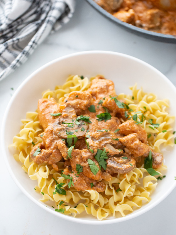 bowl of chicken stroganoff over egg noodles