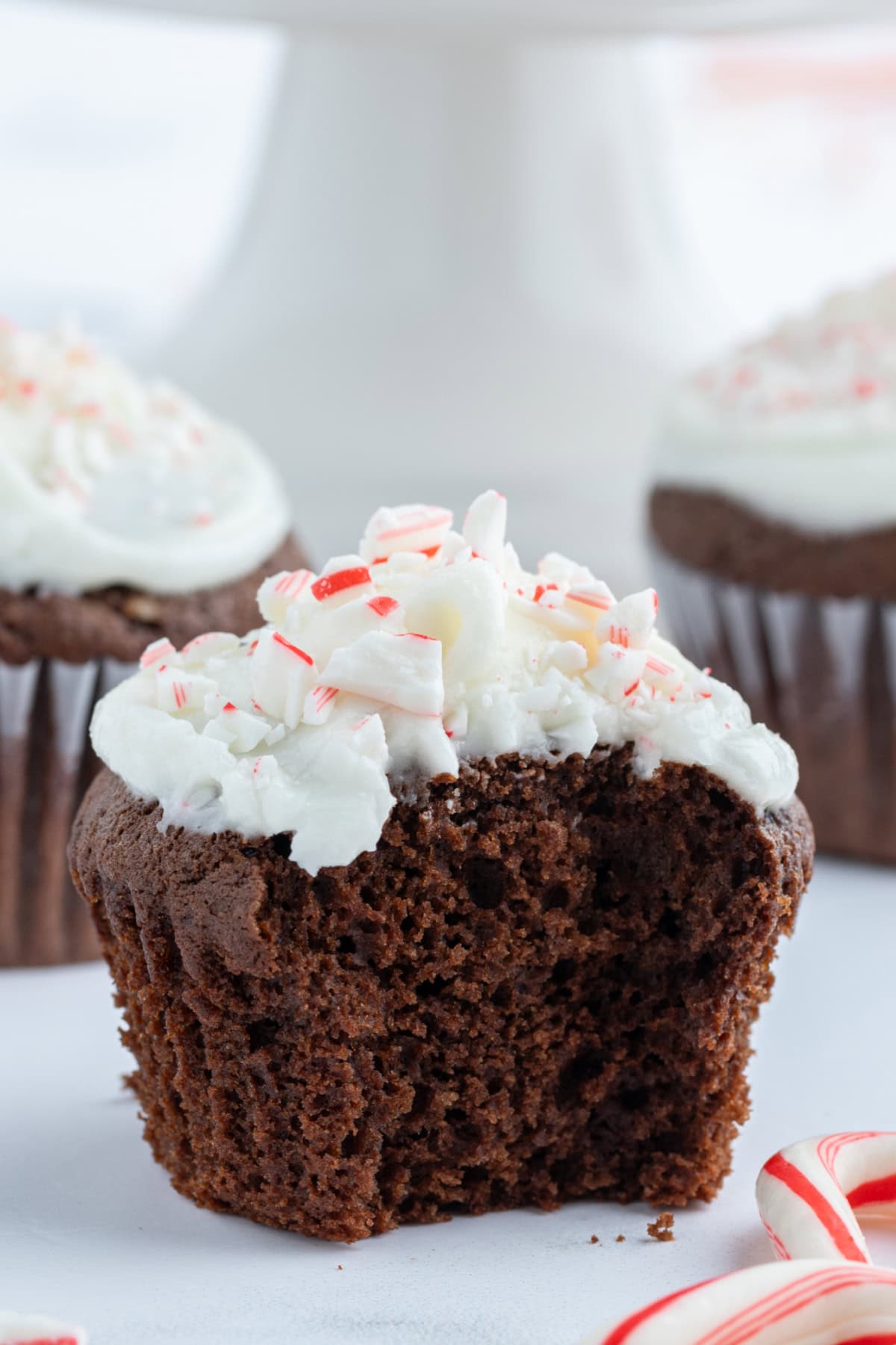 chocolate cupcakes with peppermint icing with bite taken out