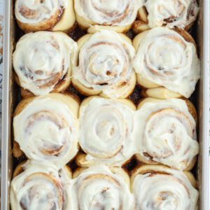 copycat cinnabon cinnamon rolls in pan with icing