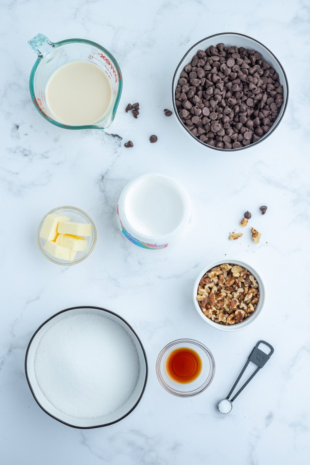 ingredients displayed for making creamy chocolate walnut fudge