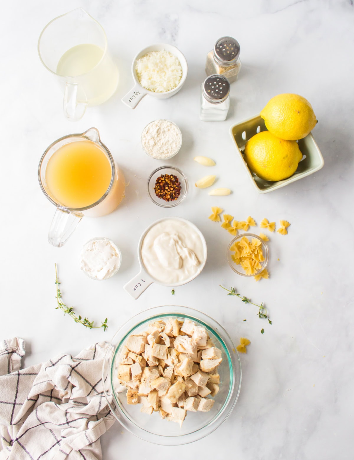 ingredients displayed for making creamy lemon chicken pasta