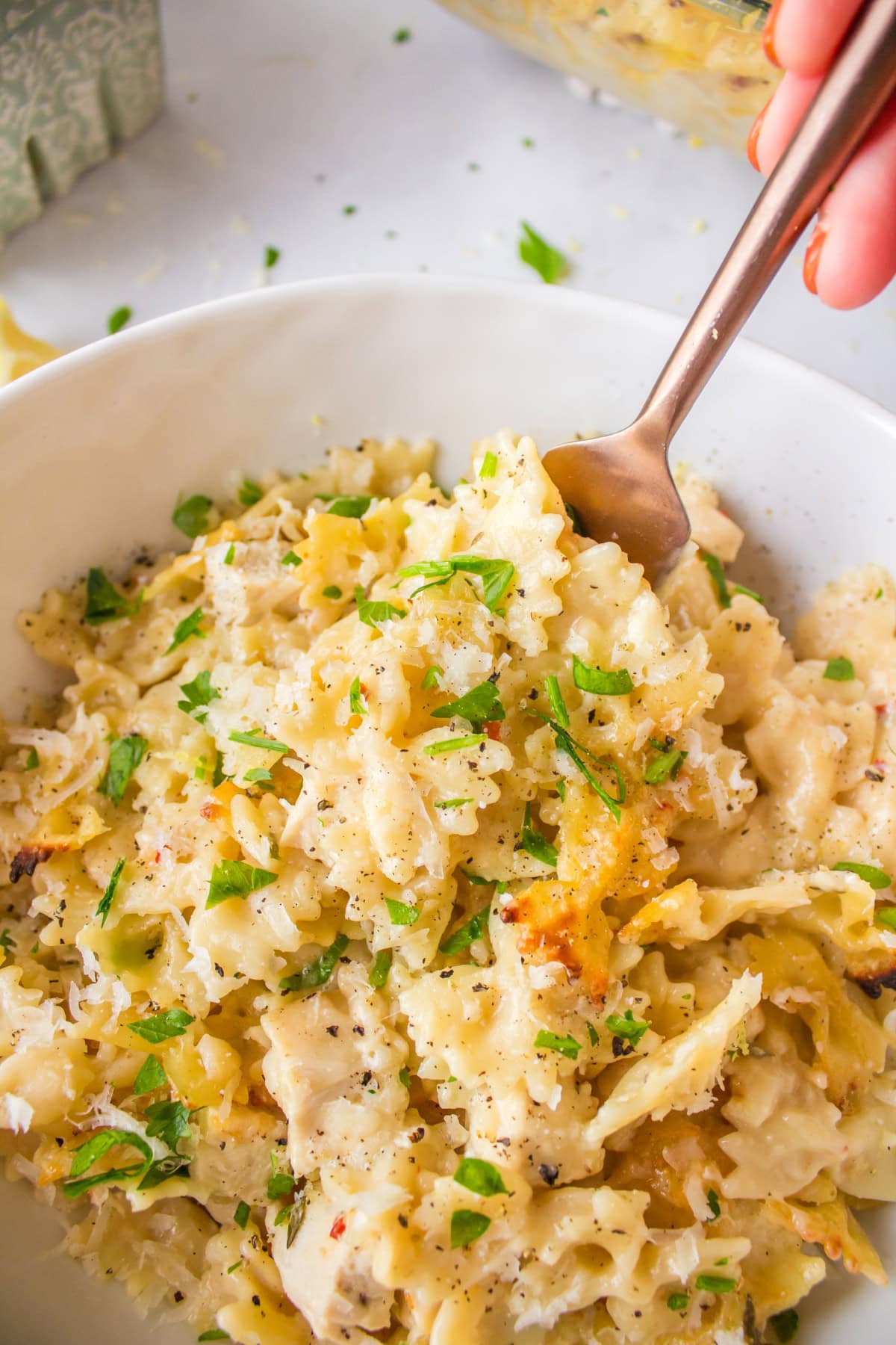 bowl of creamy lemon chicken pasta with fork