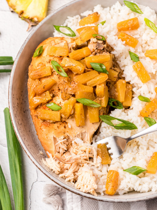 crockpot pineapple chicken on plate with rice