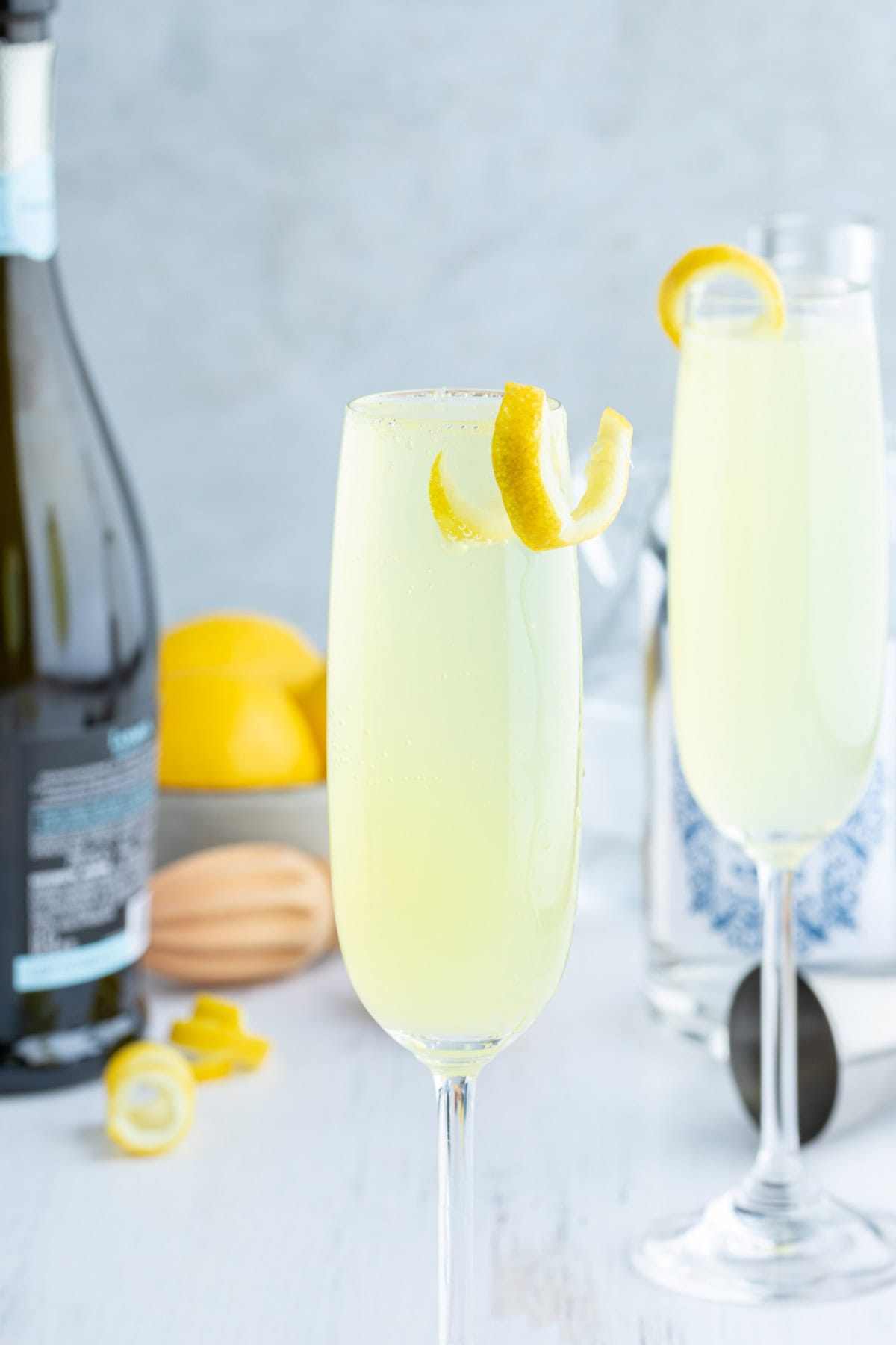 french 75 in glasses with lemon garnish