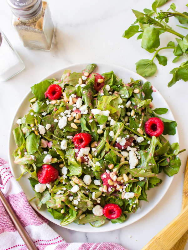 plate of goat cheese salad with raspberry vinaigrette