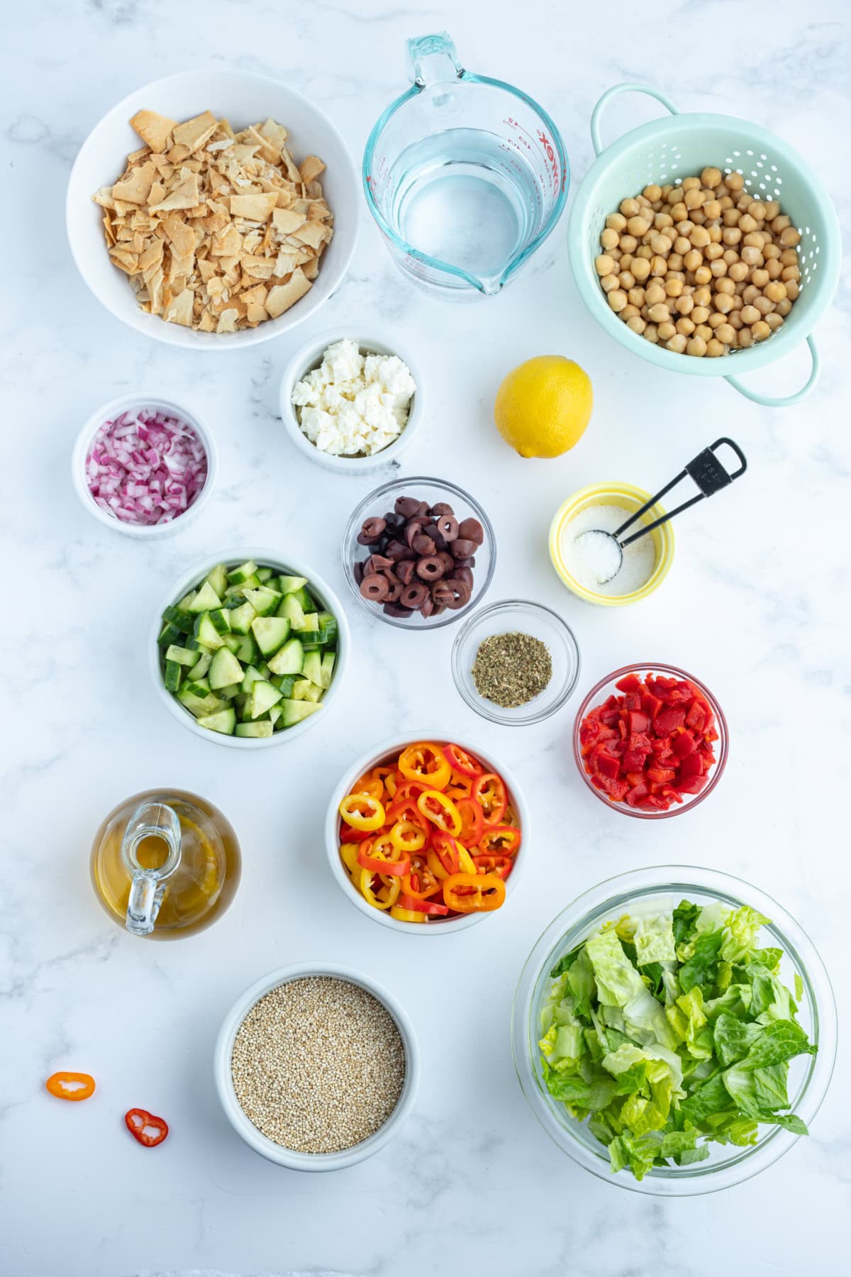 ingredients displayed for making greek quinoa chopped salad