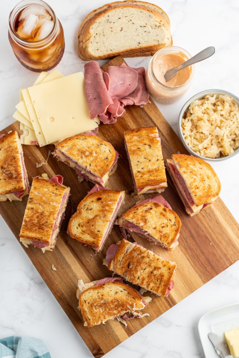 overhead shot of halved sandwiches on a cutting board