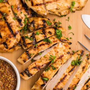 honey mustard grilled chicken sliced on cutting board