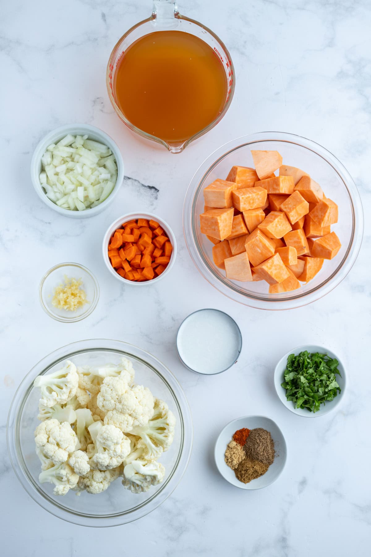 ingredients displayed for making instant pot cauliflower and sweet potato soup