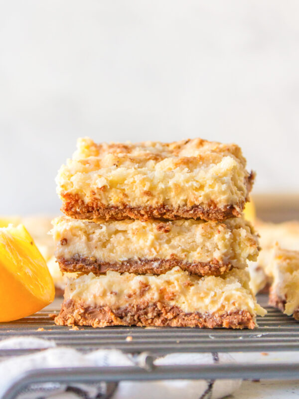 three stacked lemon bars with kit kat crust