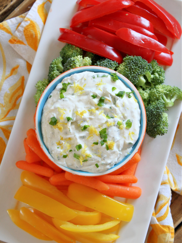 lemon chive cheese dip on display platter with veggies