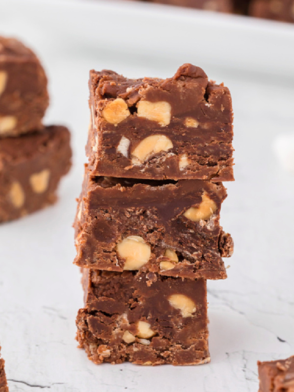 three pieces of peanut butter chocolate fudge stacked