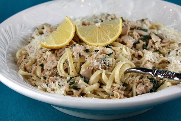 Linguine with Clam Sauce in a bowl with lemon wedges