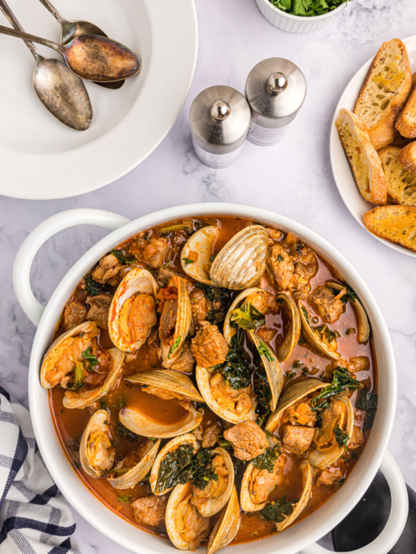 pot of pork stew with clams and mussels