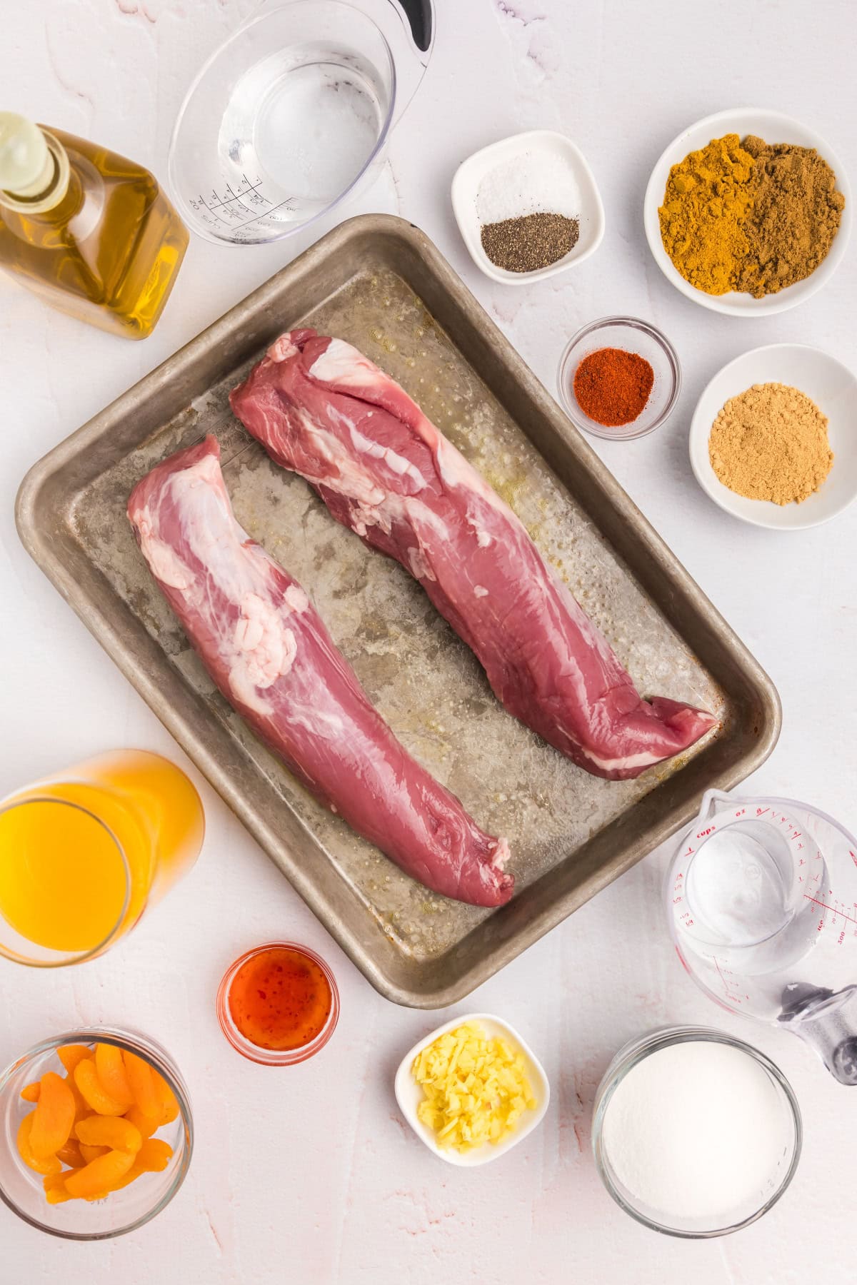 ingredients displayed for making pork tenderloin with apricot ginger sauce