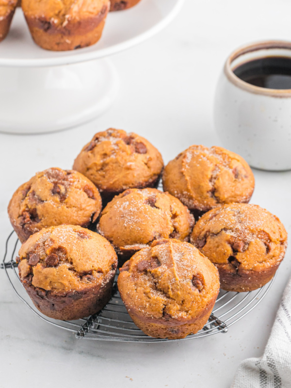 pumpkin cinnamon chip muffins on a baking rack