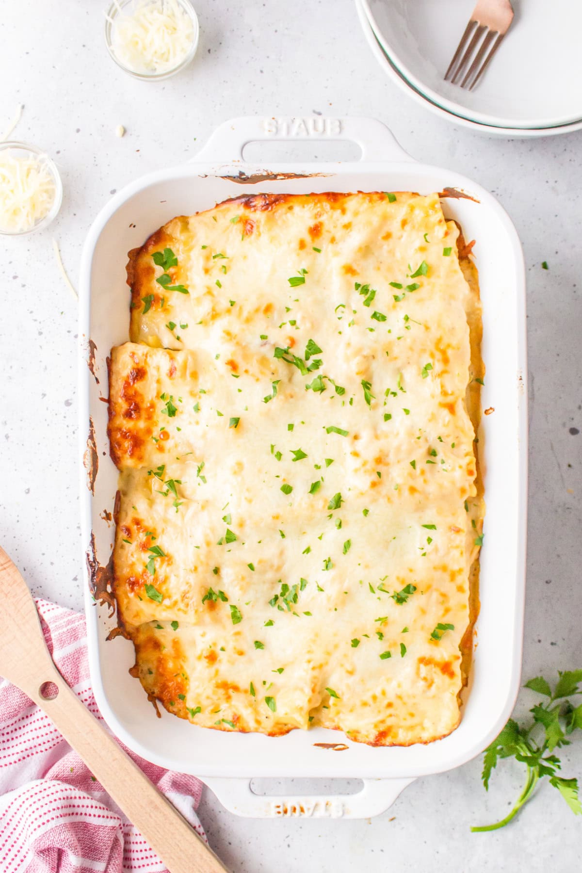 roasted vegetable lasagna roll ups in baking dish