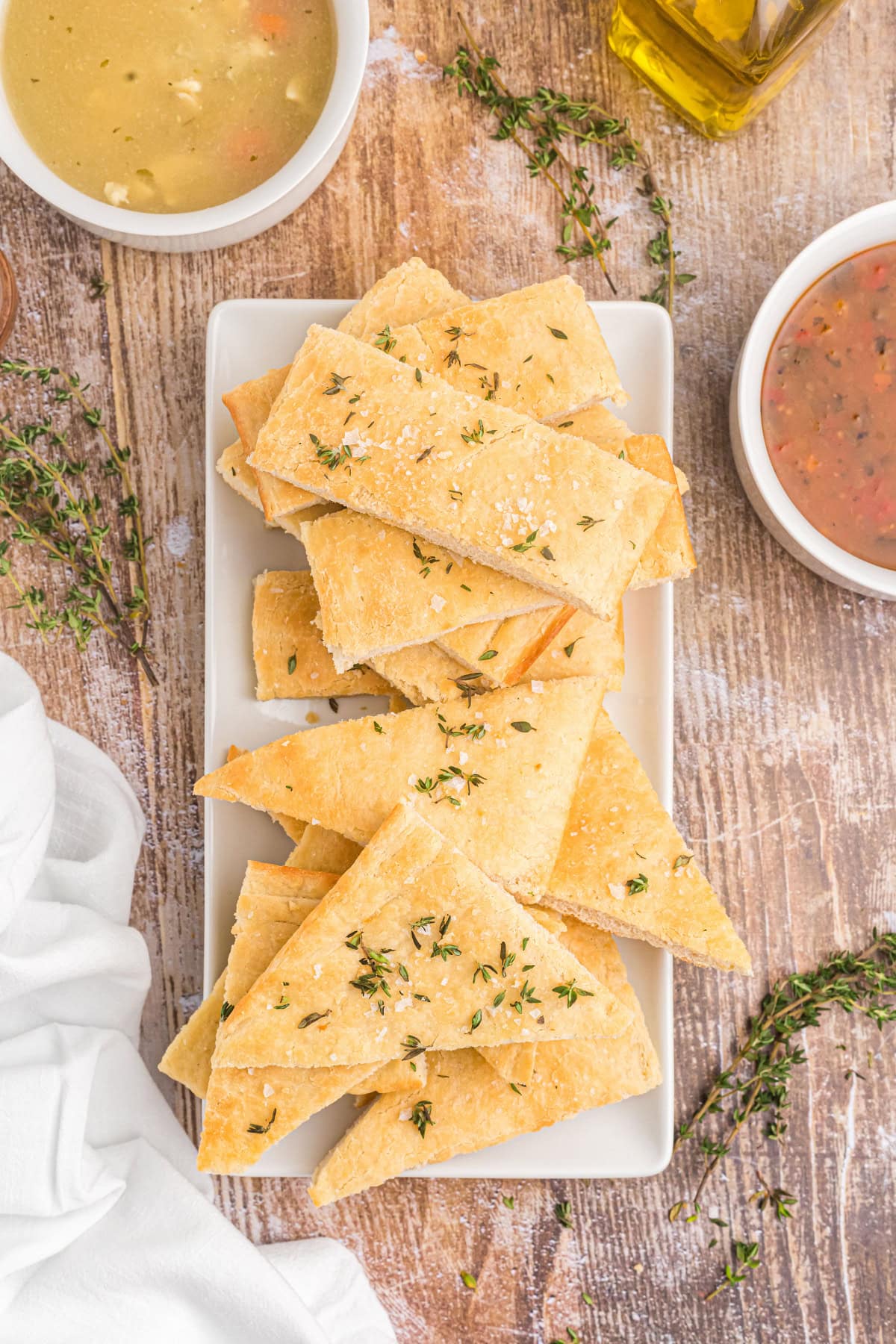 pieces of salted thyme flatbread on platter