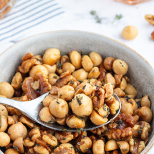 spoon in bowl of savory nuts