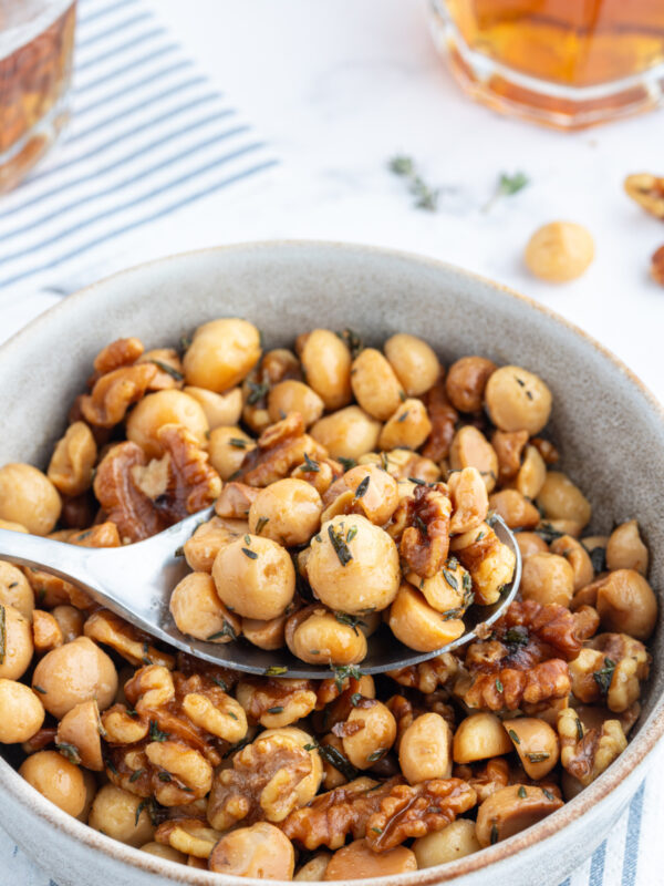 spoon in bowl of savory nuts