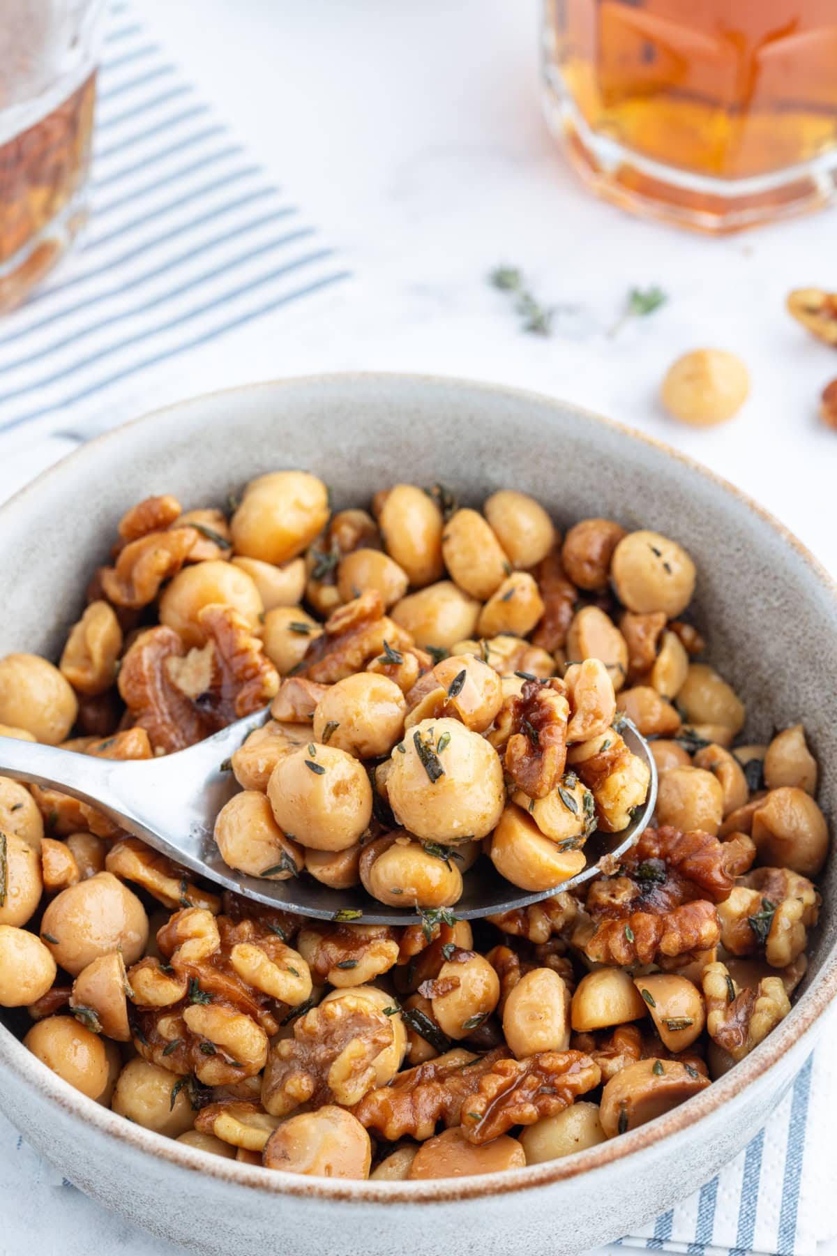 spoon in bowl of savory nuts