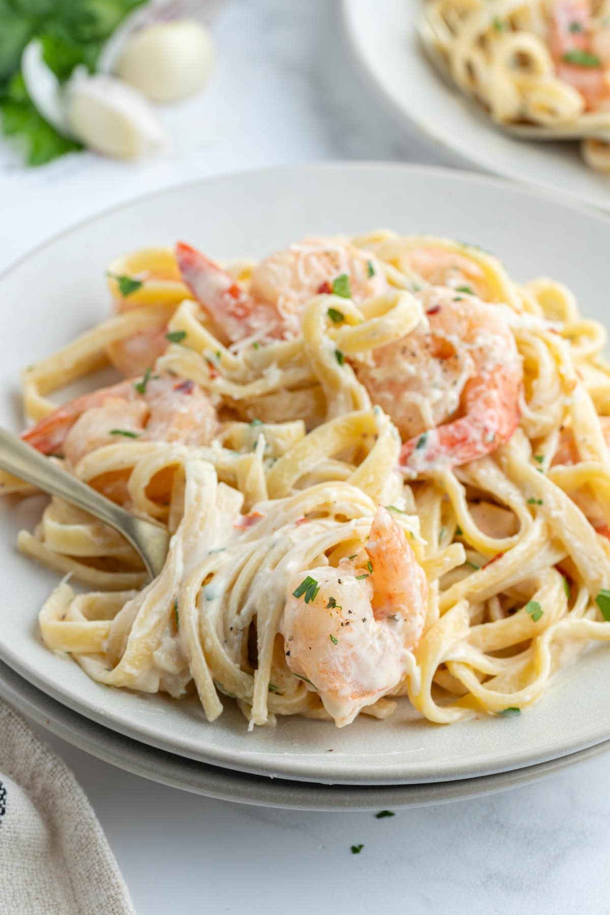 serving of shrimp scampi alfredo on plate