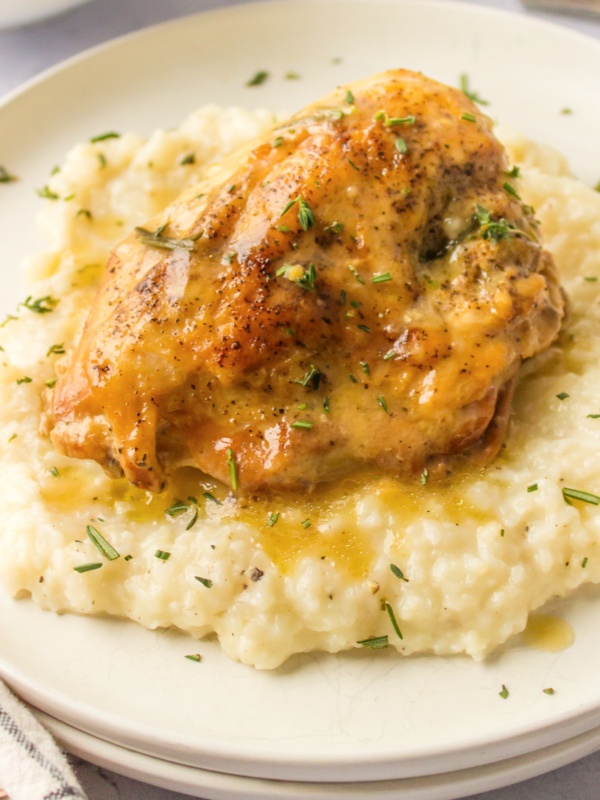 slow cooker garlic chicken on top of risotto