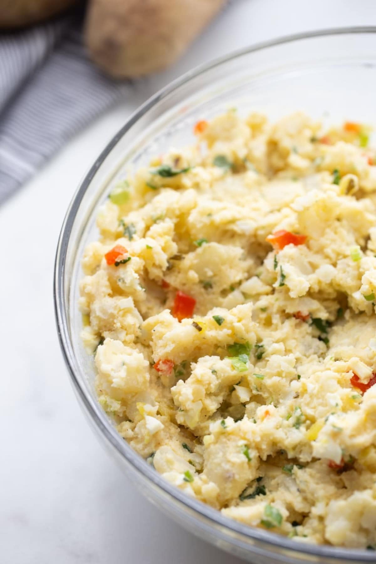 bowl of smashed potato salad in bowl